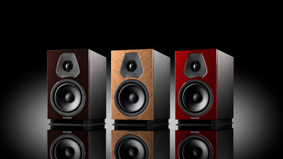 A trio of Sonus faber Lumina II Amator speakers, available in red, wenge, and walnut high gloss finishes
