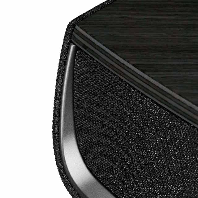 Close-up of Sonus faber Omnia wireless bookshelf speaker in Graphite, Black fabric, and Aluminum/Titanium finishes.